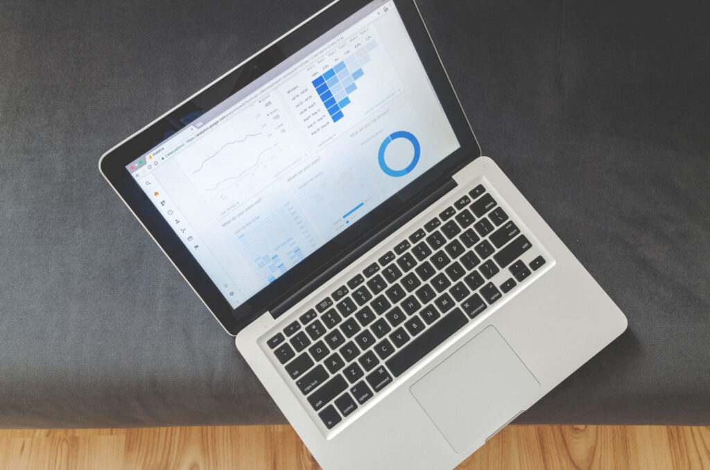 Laptop displaying analytics dashboard charts and graphs representing a white label SEO platform with client reporting for agencies
